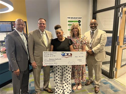 Midtown TOTY Shannon Stallworth and prize patrol
